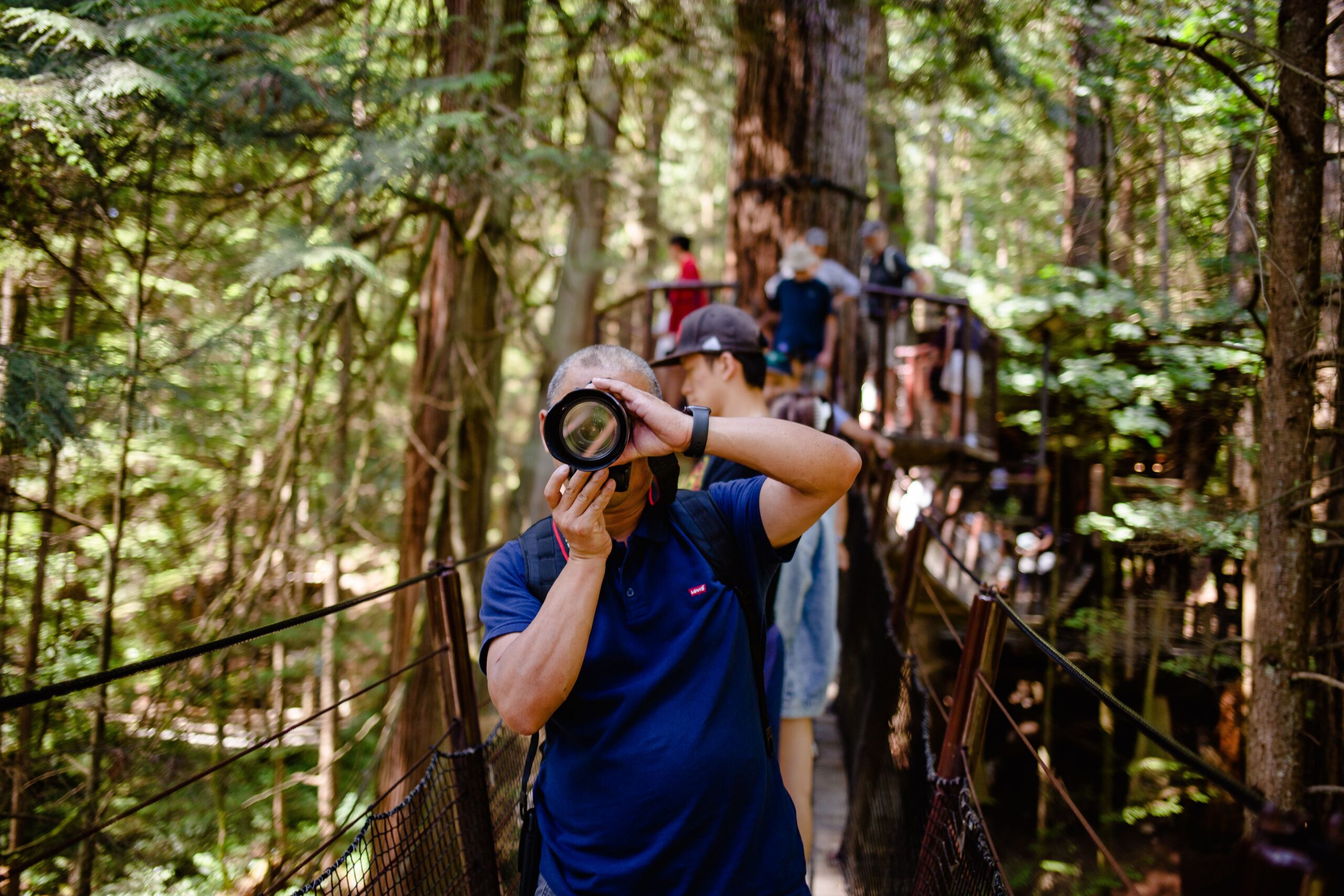 Photographer capturing Treetops Adventure at Capilano Suspension Bridge