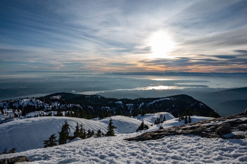 Panoramic winter view from Grouse Mountain overlooking Vancouver, the Pacific Ocean, and the Coast Mountains in British Columbia, Canada.