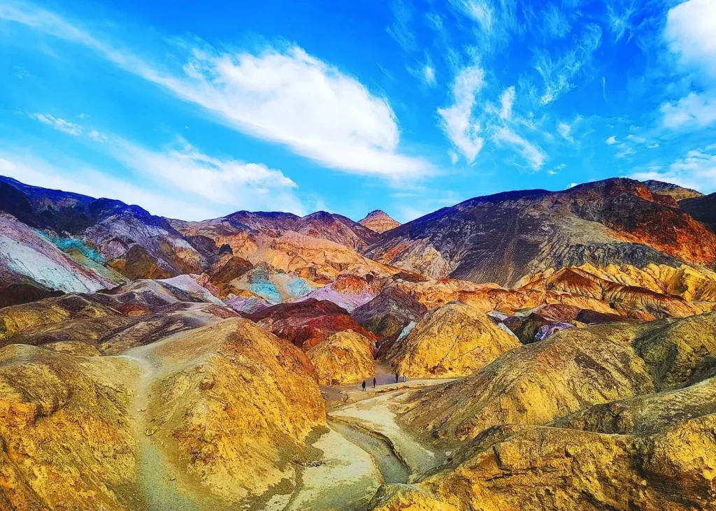 Colorful mineral-rich hills and winding desert trail at Artists Palette in Death Valley National Park
