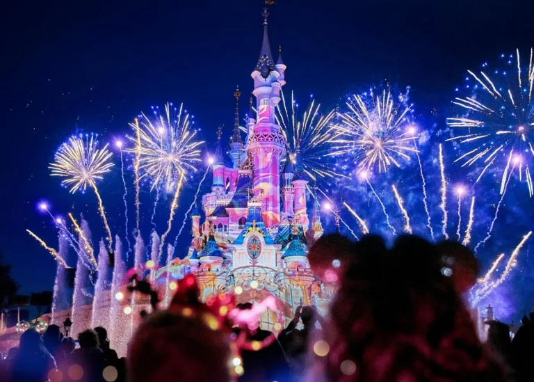 Fireworks illuminating Sleeping Beauty Castle at Disneyland Paris during a nighttime show