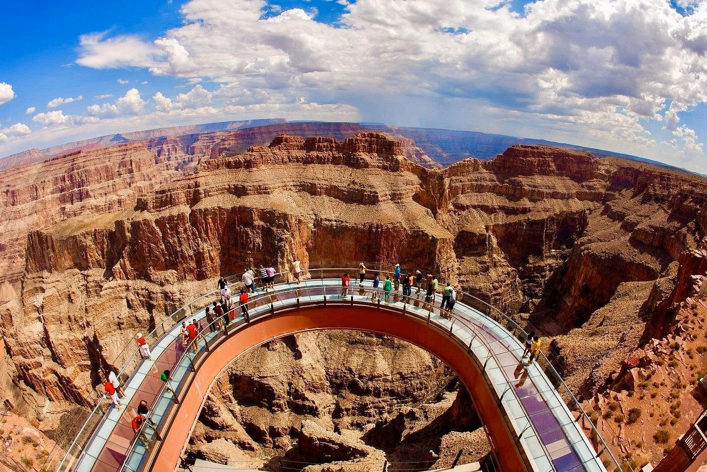 Visitors walking on the glass-bottomed Grand Canyon Skywalk above the dramatic cliffs of Grand Canyon West