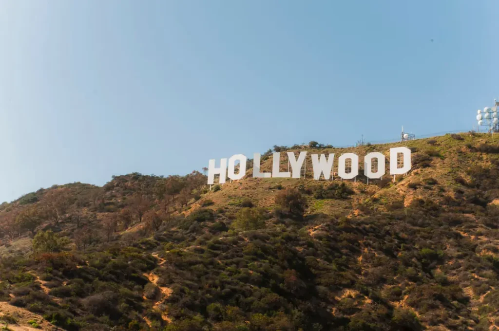 Iconic Hollywood Sign on the hillside of Mount Lee in Los Angeles under a clear blue sky