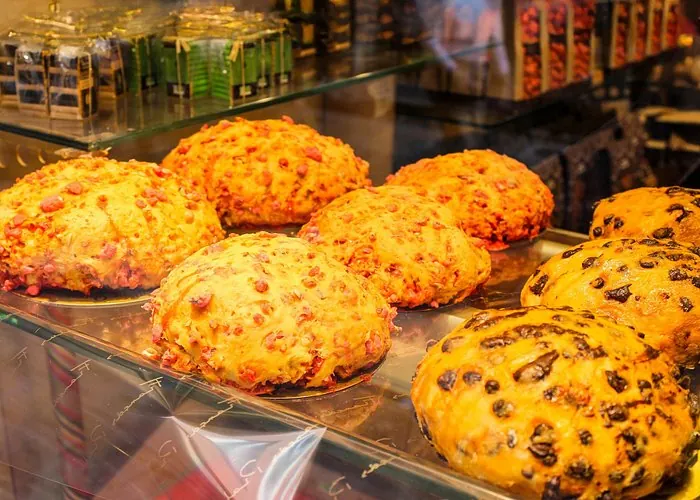 Golden French savory pastries and baked specialties displayed in a bakery window