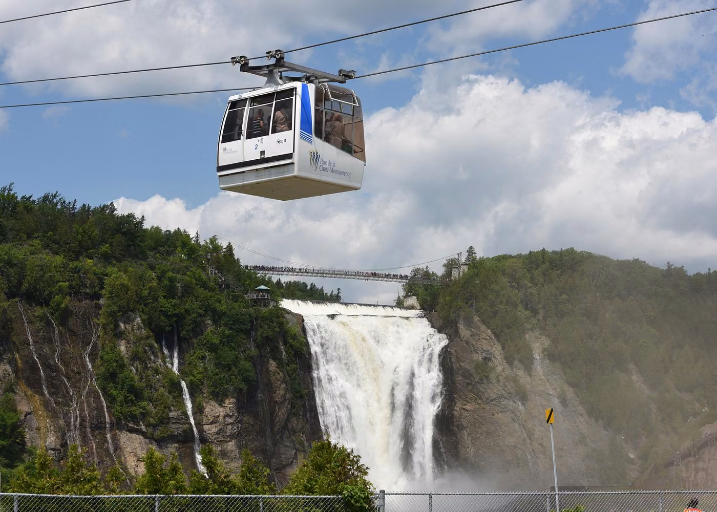 Montmorency Falls cable car above the waterfall and suspension bridge near Quebec City