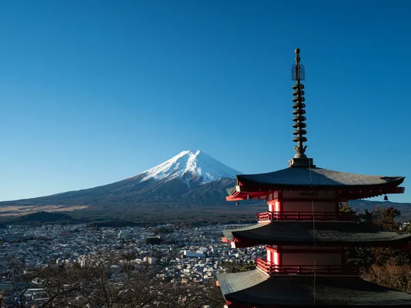 Mount Fuji rising above a scenic Japanese landscape