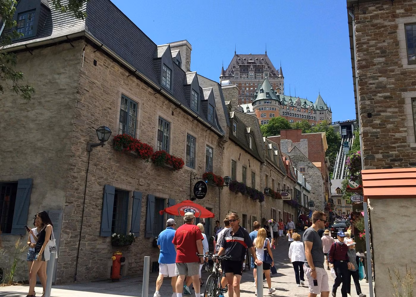Historic Petit-Champlain street in Old Quebec City with Château Frontenac in the background