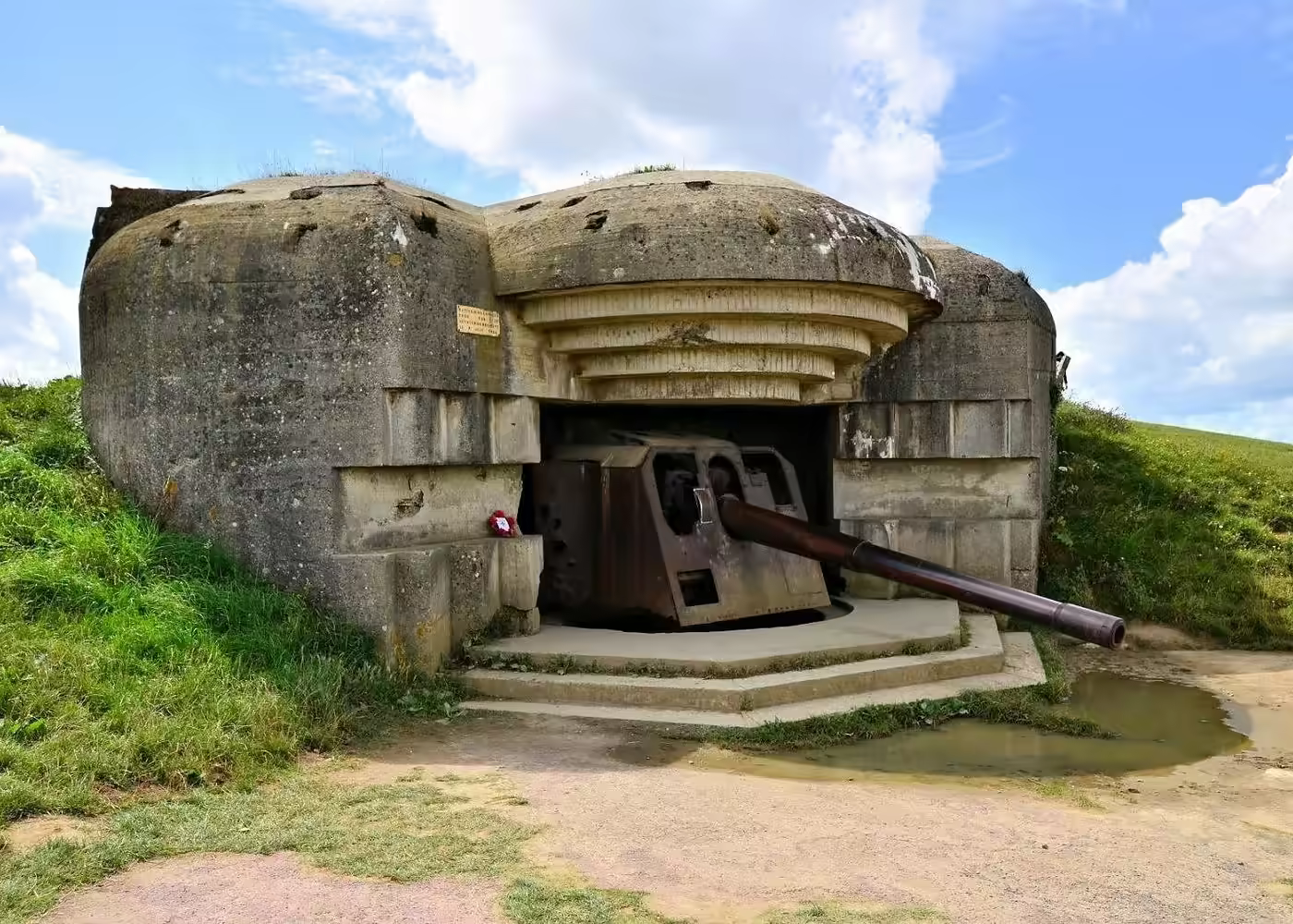 German World War II bunker and artillery gun at Pointe du Hoc in Normandy, France