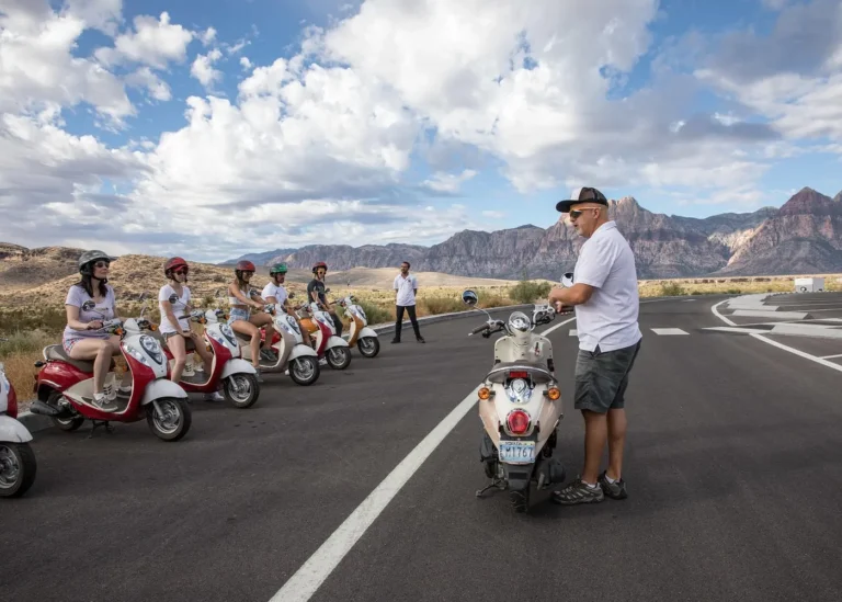 Group of tourists on motor scooters during a guided tour near Red Rock Canyon in Las Vegas, Nevada