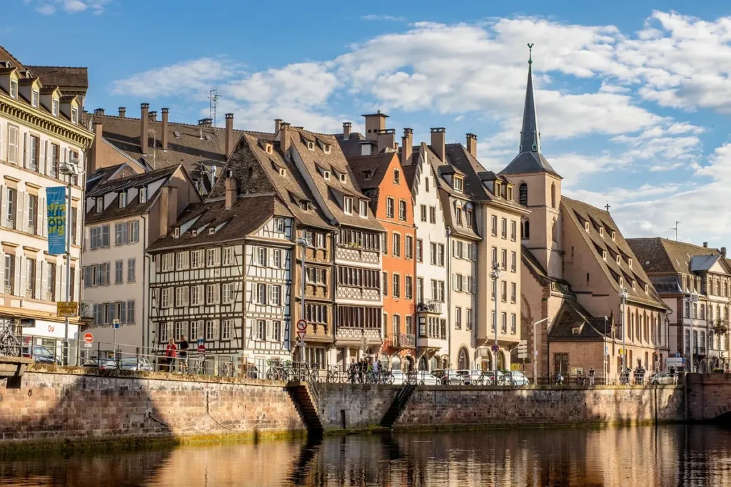 Historic half-timbered houses and church beside the River Ill in Strasbourg, France